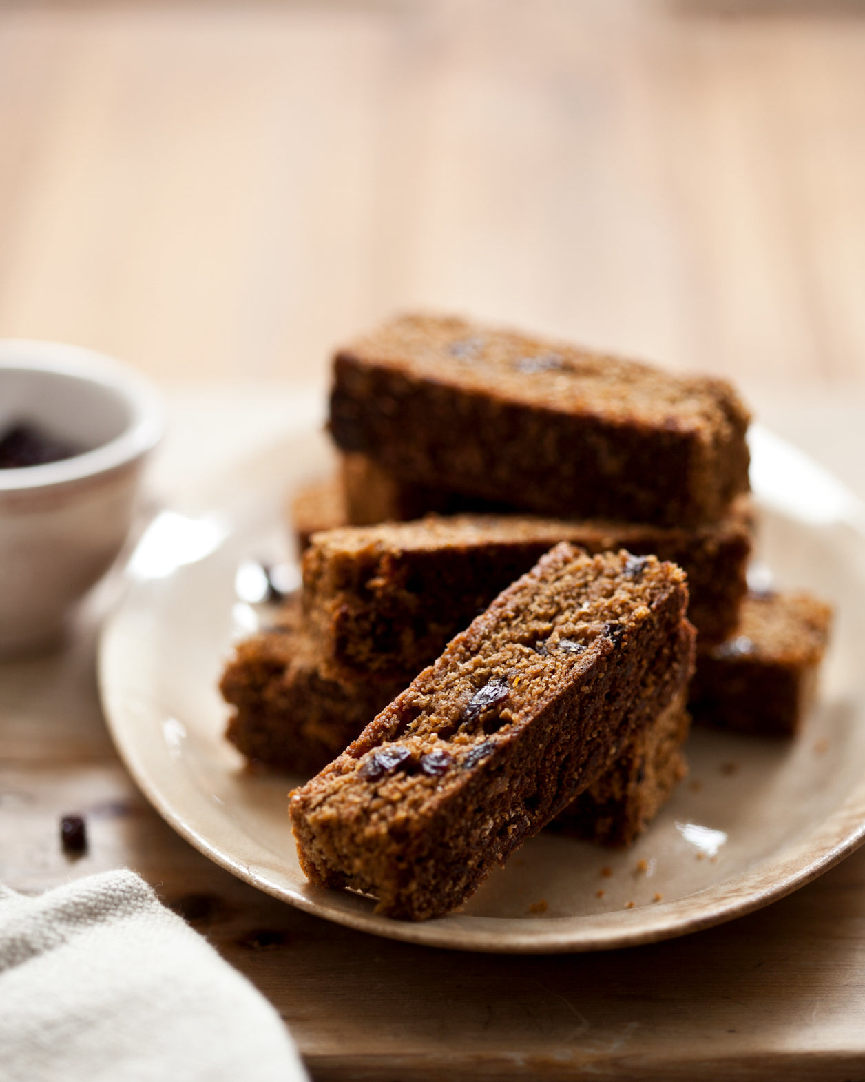 Hermits dotted with dried currants on a plate with a blurred background