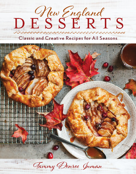 Book cover of 'New England Desserts' with apple galettes and autumn leaves.
